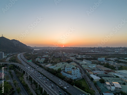 Aerial view of Sanxia District with cars on highway during sunset in New Taipei City  Taiwan.