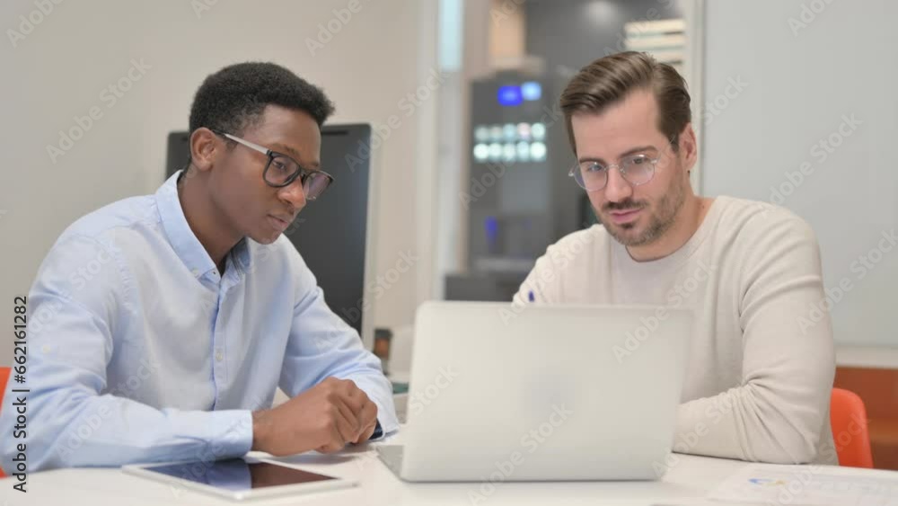 Business People Discussing Project while Sitting in Office
