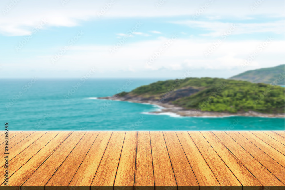 Fototapeta premium Empty wooden floor for product display montages with sea and mountain background. 