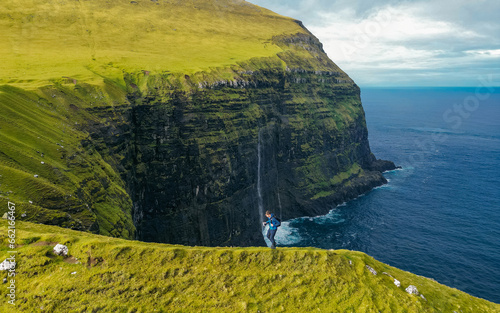 Impression of the wild Faroe coast in the North Atlantic. Paralyzing cliffs photo