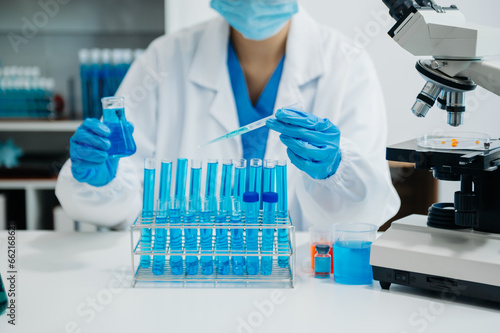 Modern medical research laboratory. female scientist working with micro pipettes analyzing biochemical samples  advanced science chemical laboratory