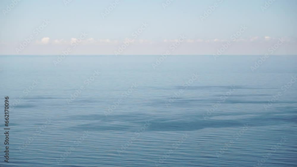 Aerial panoramic view of beautiful sunset above sea. Beautiful seascape. Sun glare, small waves on the water surface. Evening. Horizon. Nobody. No people. Never-ending beauty of nature. Aerial panoramic view of beautiful sunset above sea. Beautiful seascape. Sun glare, small waves on the water surface. Evening. Horizon. Nobody. No people. Never-ending beauty of nature.
