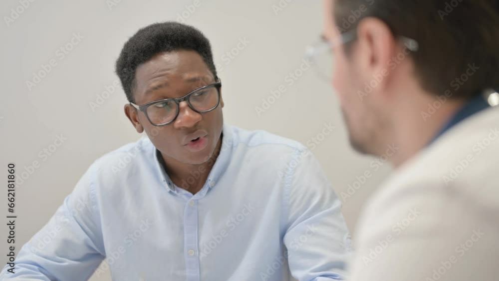 Close up of African Man Talking with Doctor Close up of African Man Talking with Doctor