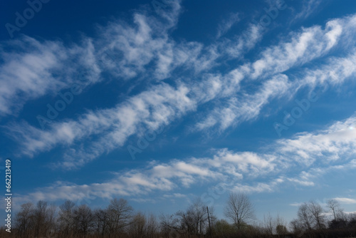 Whispy cloud on blue sky generative AI