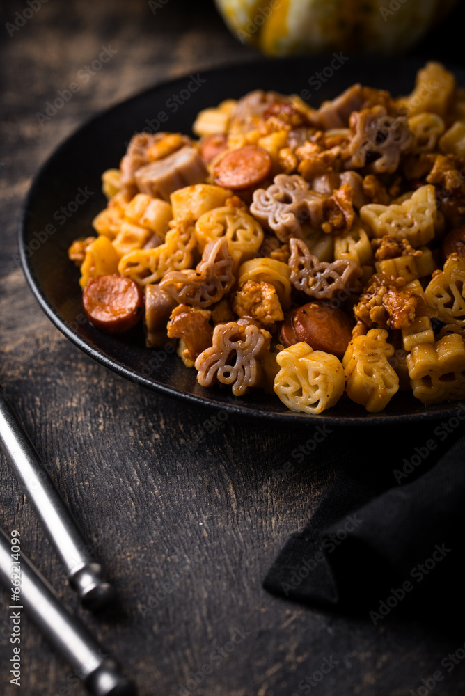 Halloween pasta in shape of spider, bat and pumpkin Halloween pasta in shape of spider, bat and pumpkin
