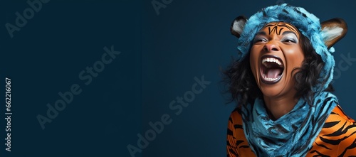 Generative AI banner of a a copy space banner of a smiling Happy Adult Black Woman Wearing a Tiger Costume for Halloween on a Blue Banner with Space for Copy