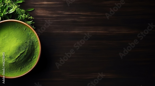 Matcha tea powder in a wooden plate on dark background with whisk  top view  copy space. Generative AI