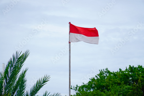 Indonesian Flag, Red and white Flag, national symbol of Indonesia is waving on blue sky