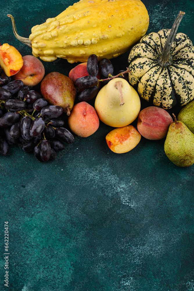 Assortment of autumn fruit. Pear, peach, grapes