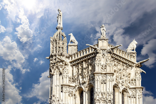 Saint-Jacques Tower (Tour Saint-Jacques) against the background of a beautiful sky with clouds. Located on Rivoli street, Paris, France. This 52 m Flamboyant Gothic tower (XVI century)