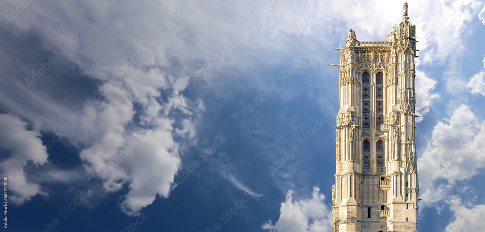 Saint-Jacques Tower (Tour Saint-Jacques) against the background of a beautiful sky with clouds. Located on Rivoli street, Paris, France. This 52 m Flamboyant Gothic tower (XVI century) - obrazy, fototapety, plakaty 