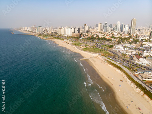 view from the shore to the modern district of Tel Aviv. Top view of the capital of Israel. Clean beautiful beach in the city center of the metropolis on the background of high skyscrapers