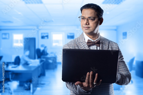 Businessman with laptop. Ma...