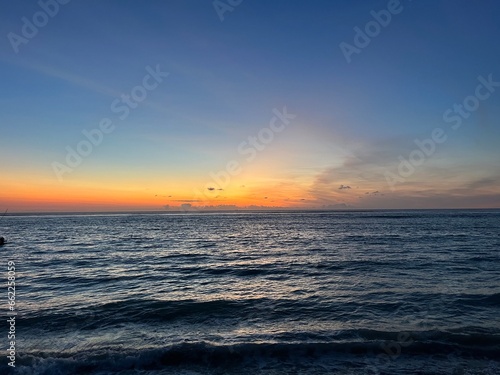 Colorful sky after sunset over blue Indian Ocean in Mauritius © Manuel