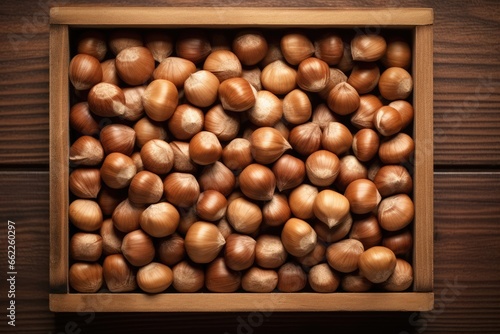 Top view of hazelnuts in a wooden box