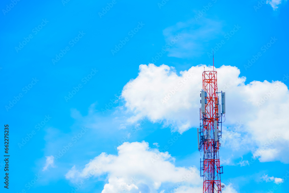 Telecommunication tower pole of mobile phone network with blue sky and cloud Telecommunication tower pole of mobile phone network with blue sky and cloud