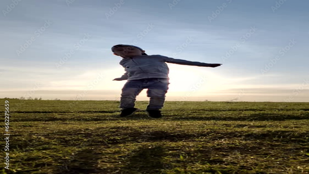 boy jumps high in the sunset light. Slow motion. boy jumps high in the sunset light. Slow motion.
