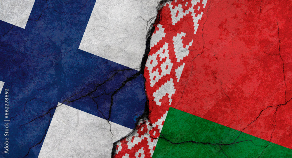 Fototapeta premium Flags of Finland and Belarus, texture of concrete wall with cracks, grunge background, military conflict concept