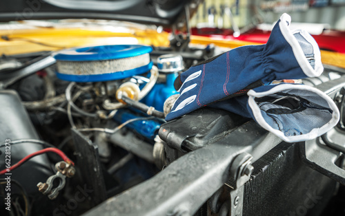 Protection Gloves Laying Next to Classic Car Engine Compartment