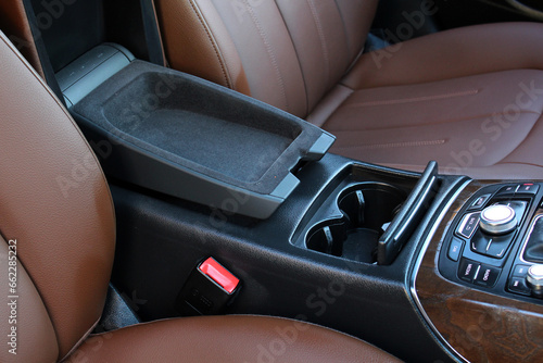 Lux car armrest with open box. Premium Car inside. Modern car interior with light brown high-tech comfortable seats. Interior of prestige car.  © Best Auto Photo