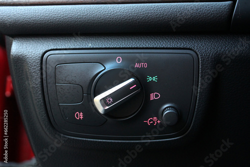 Close up of light control in car. Headlight switch, fog lights, automatic control of switching on and off the car light.