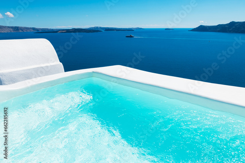 Luxury swimming pool with sea view. Santorini island, Greece.