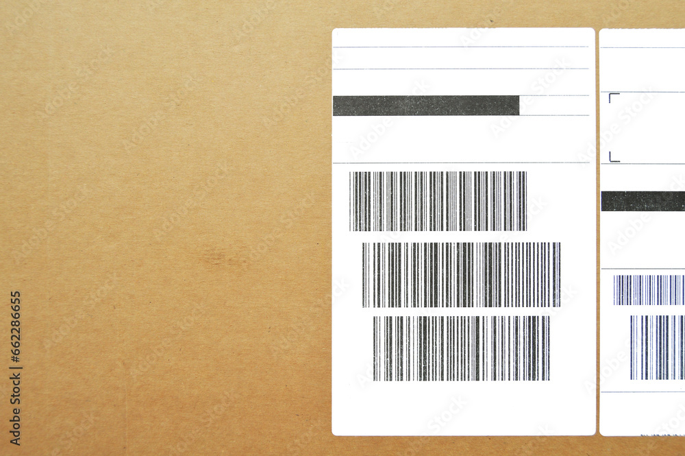 Brown and beige cardboard paper mail envelope on sticky barcodes Brown and beige cardboard paper mail envelope on sticky barcodes