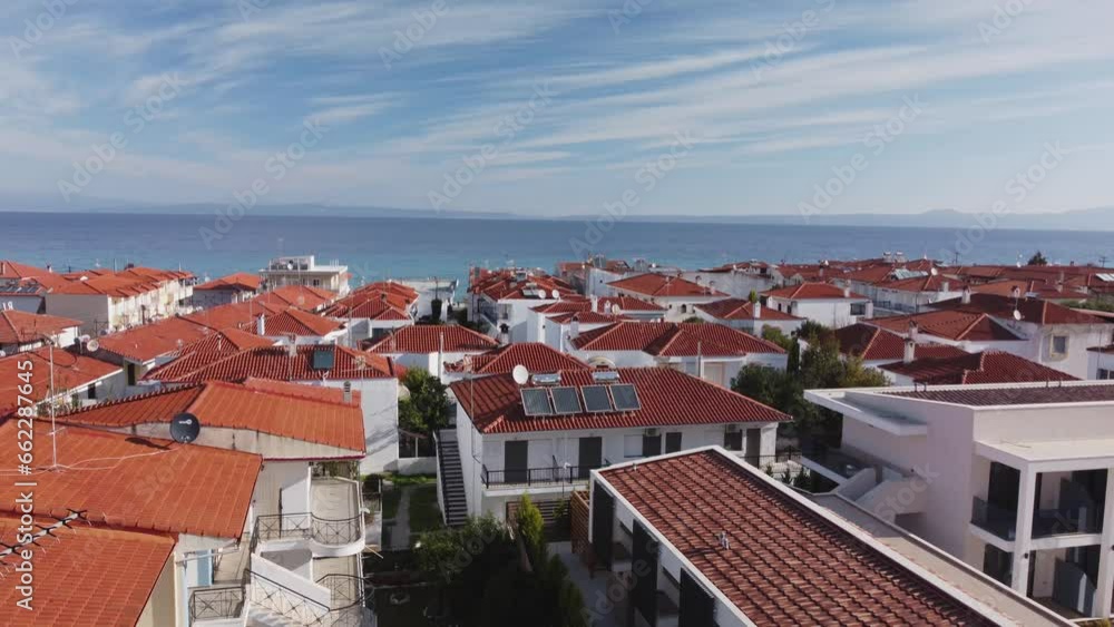 Village Polichrono in Chalkidiki. Greece. Aerial view of houses with red ceramic tiles. Village Polichrono in Chalkidiki. Greece. Aerial view of houses with red ceramic tiles.