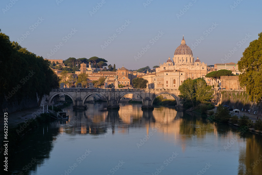 Morning view of Ponte Sant'Angelo and St Peter Basilica in Rome, Italy
