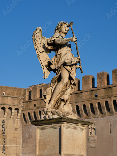 Statue of an angel at Castel Sant'Angelo (Mausoleum of Hadrian), landmark roman building and Papal fortress and prison in Rome, Italy 