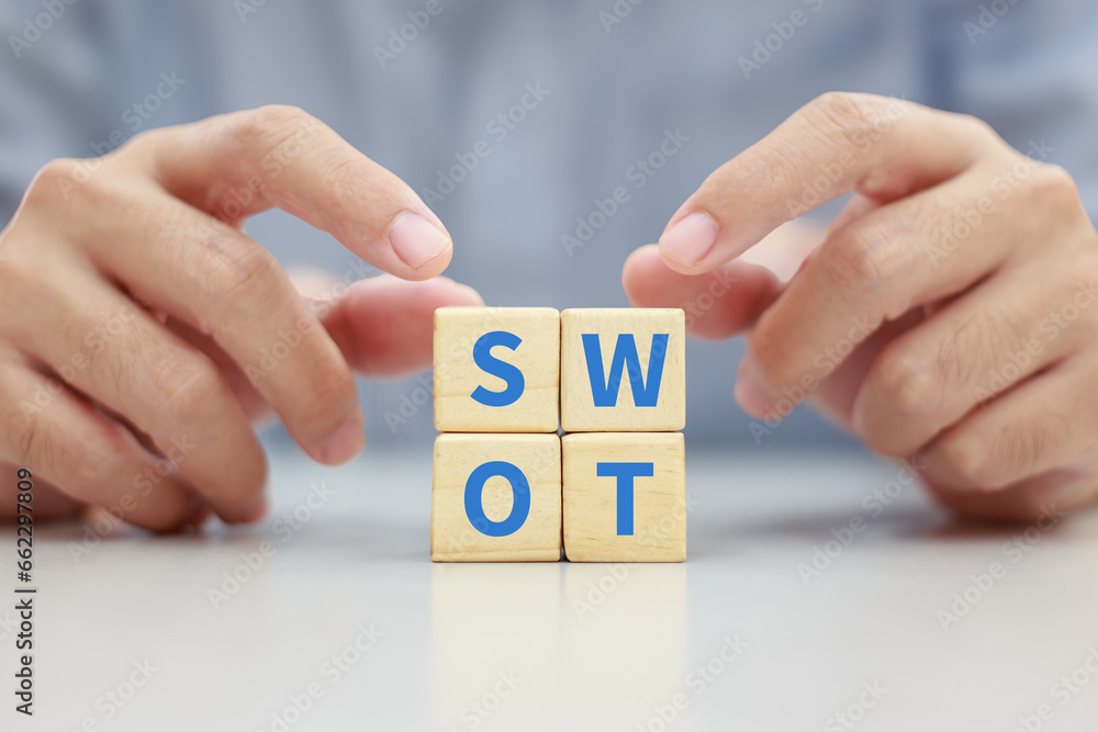 Concept of SWOT analysis and business strategy planning technique. Strengths, weaknesses, threats and opportunities of company. SWOT symbol on wooden cube block. - obrazy, fototapety, plakaty 