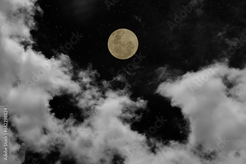 Full moon on the sky with clouds.