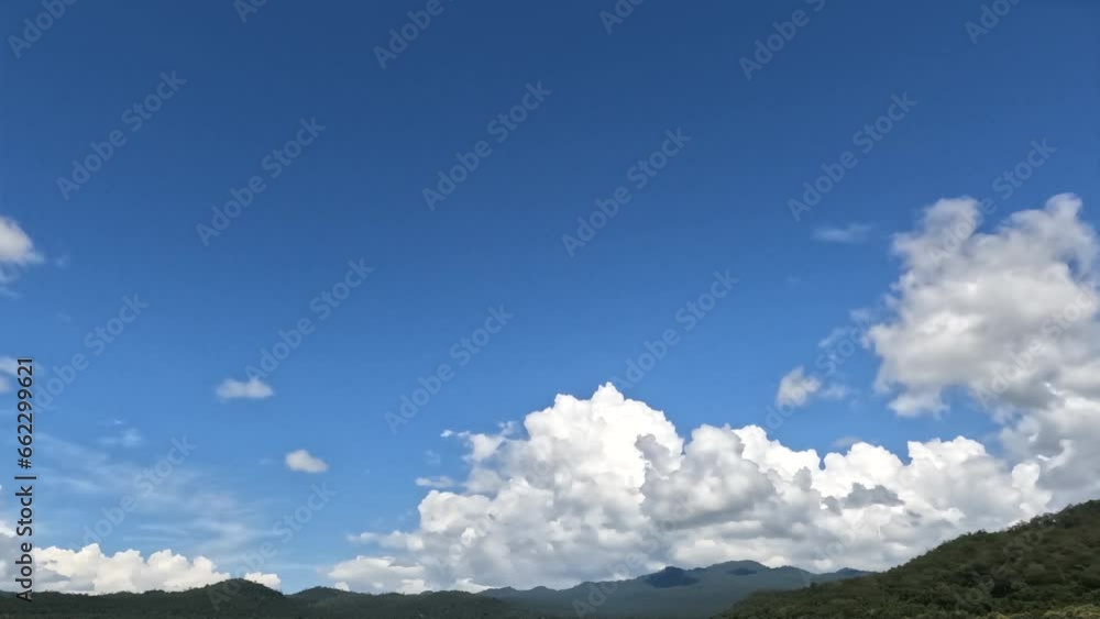 Time-lapse of beautiful blue sky with cloudy movement. Puffy fluffy white clouds. Cumulus cloudscape time lapse. Time-lapse of beautiful blue sky with cloudy movement. Puffy fluffy white clouds. Cumulus cloudscape time lapse.