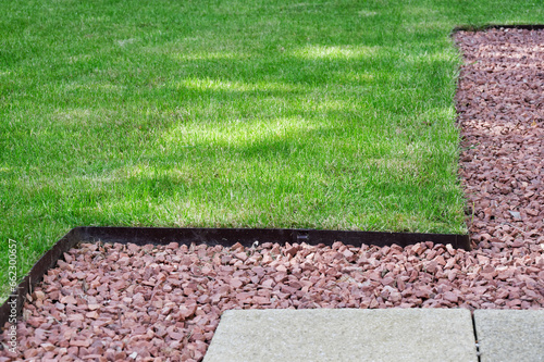 Lawn edging made of metal showing straight and neat finish