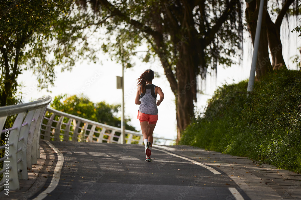 young asian woman jogging running in park young asian woman jogging running in park