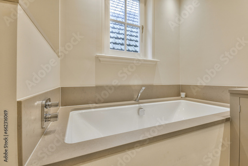 a bathroom with a sink and window in the corner  taken from above to see how it looks like this