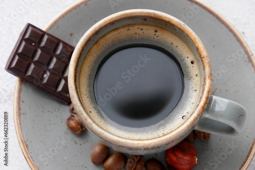 A cup of aromatic coffee and delicious dark chocolate
