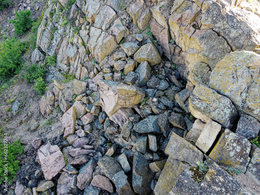 Sheer stone rock, aerial view. Boulders from a bird's eye view. Sheer stone rock, aerial view. Boulders from a bird's eye view.