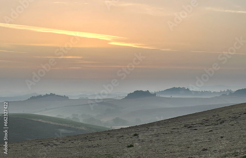 Sunrise with fog in the rolling hills of Tuscany, background, texture