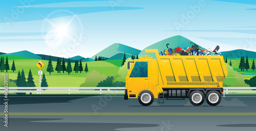 A yellow garbage truck is passing along the highway.