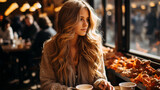 fashionable portrait of a young fashionable blonde woman at a table in a cafe