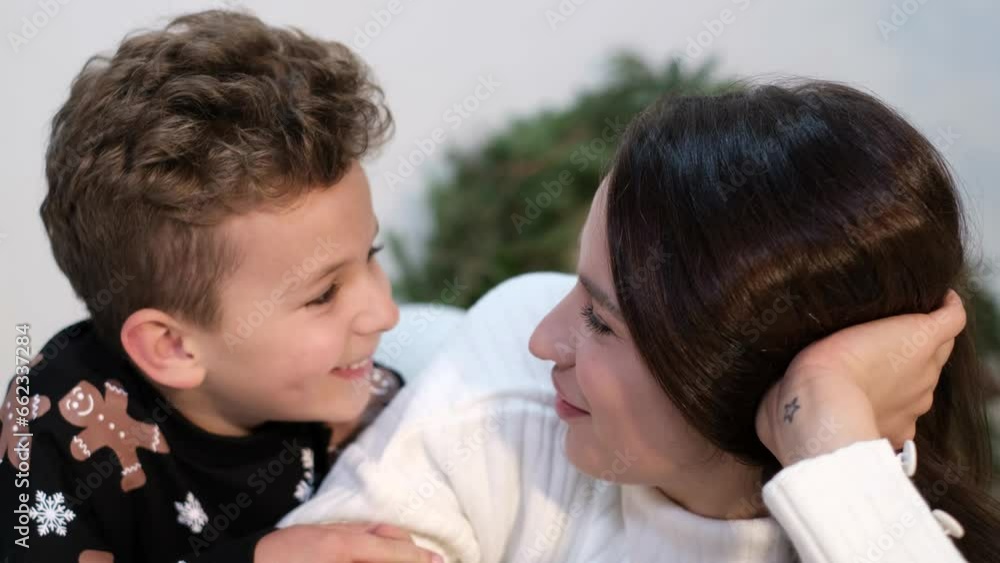 happy young family spends time together near the Christmas tree during the Christmas holidays. Family values happy young family spends time together near the Christmas tree during the Christmas holidays. Family values