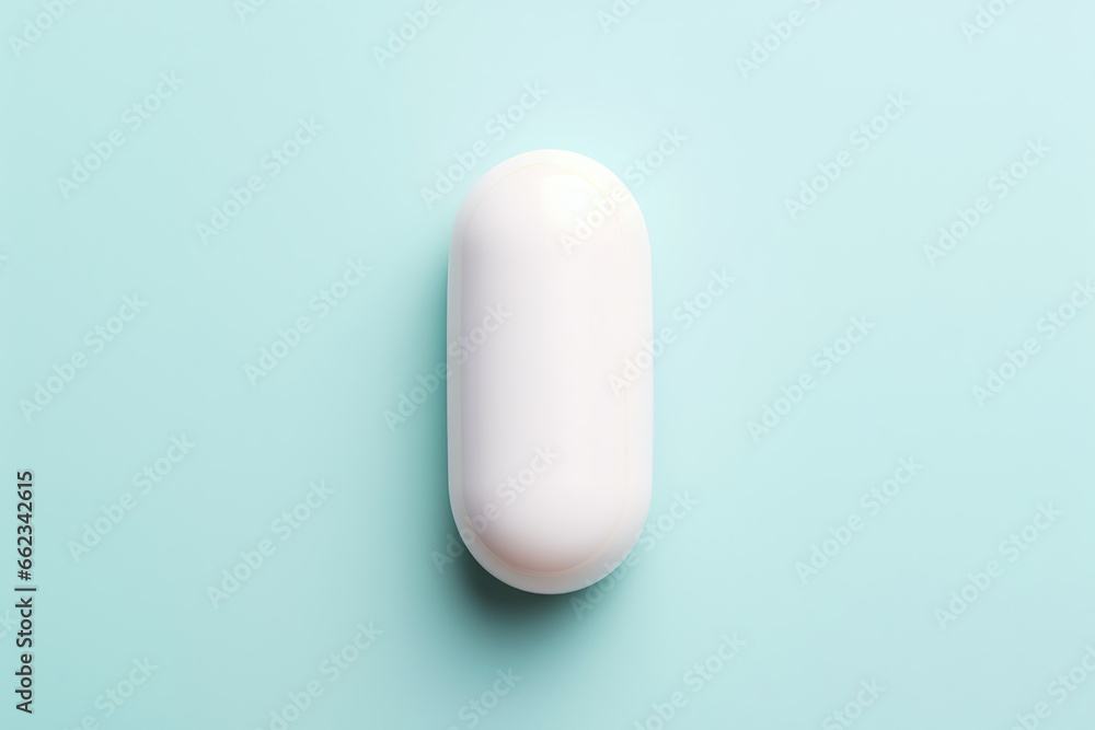 pill on light blue background, top view pill on light blue background, top view