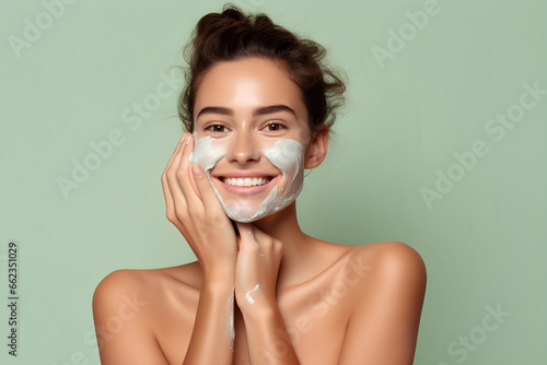 Close up portrait of young black women smiling with green clay mask on face natural organic skincare beauty shot photo