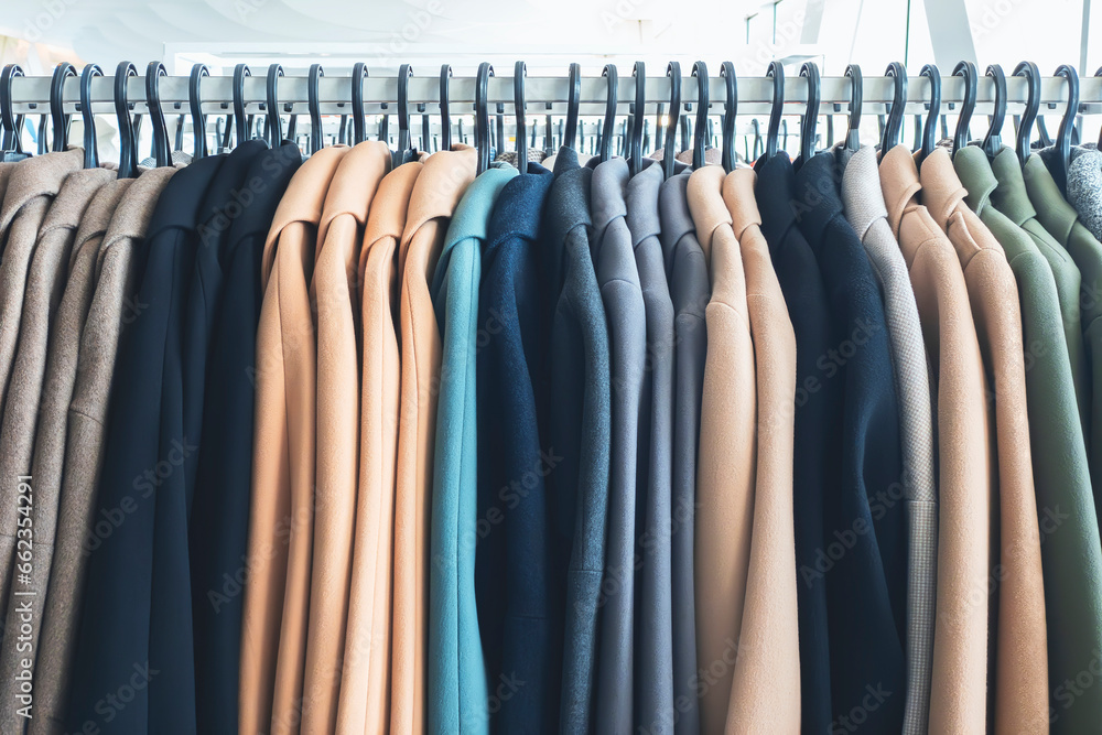 Clothes hanging in row. Many clothes for autumn or fall season. Clothes hanging in row. Many clothes for autumn or fall season.