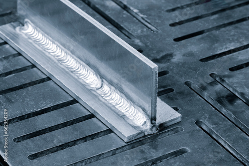 welding seam onto steel metal Industrial steel welder in factory