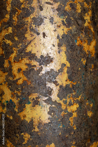 old rusty sheet metal painted with yellow paint