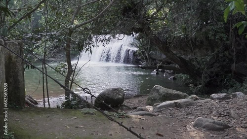 cascada la motilona, beautiful tropical waterfalls in the deep rainforest of the jungle near Paicol in Colombia cascading into a turquoise pool along the riverbed. photo