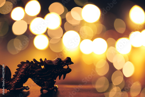 Golden dragon symbol of the year 2024 on a dark background