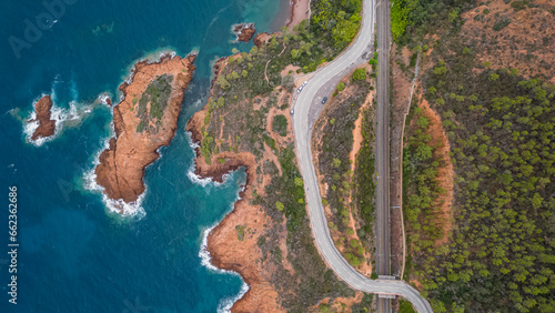 Aerial view of the Massif de L'Esterel and a beautiful winding road over the cliffs falling into the Mediterranean Sea. French Riviera. Cote d'Azur photo